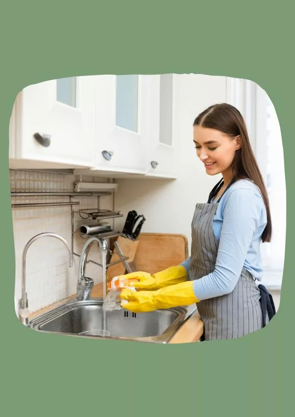 Woman washing dishes at home